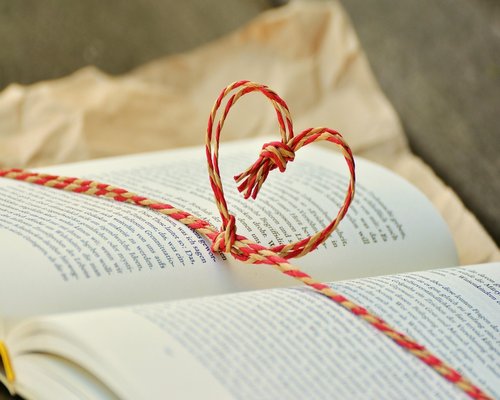 A person resting calmly with a book