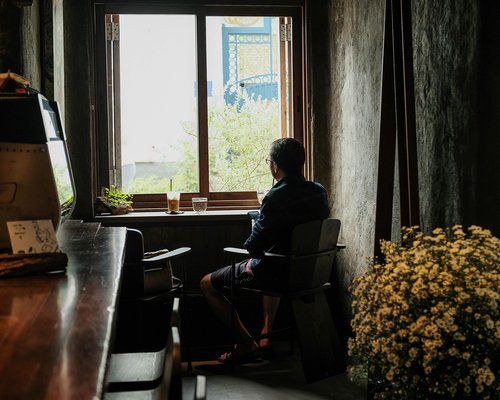 Person looking out a window thoughtfully