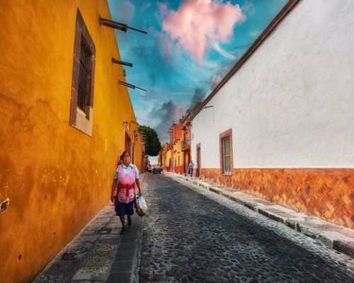 Person walking comfortably on a Mexican city street