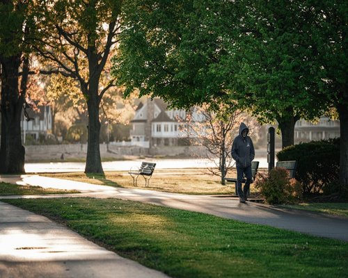 Person taking a slow walk in a quiet neighborhood